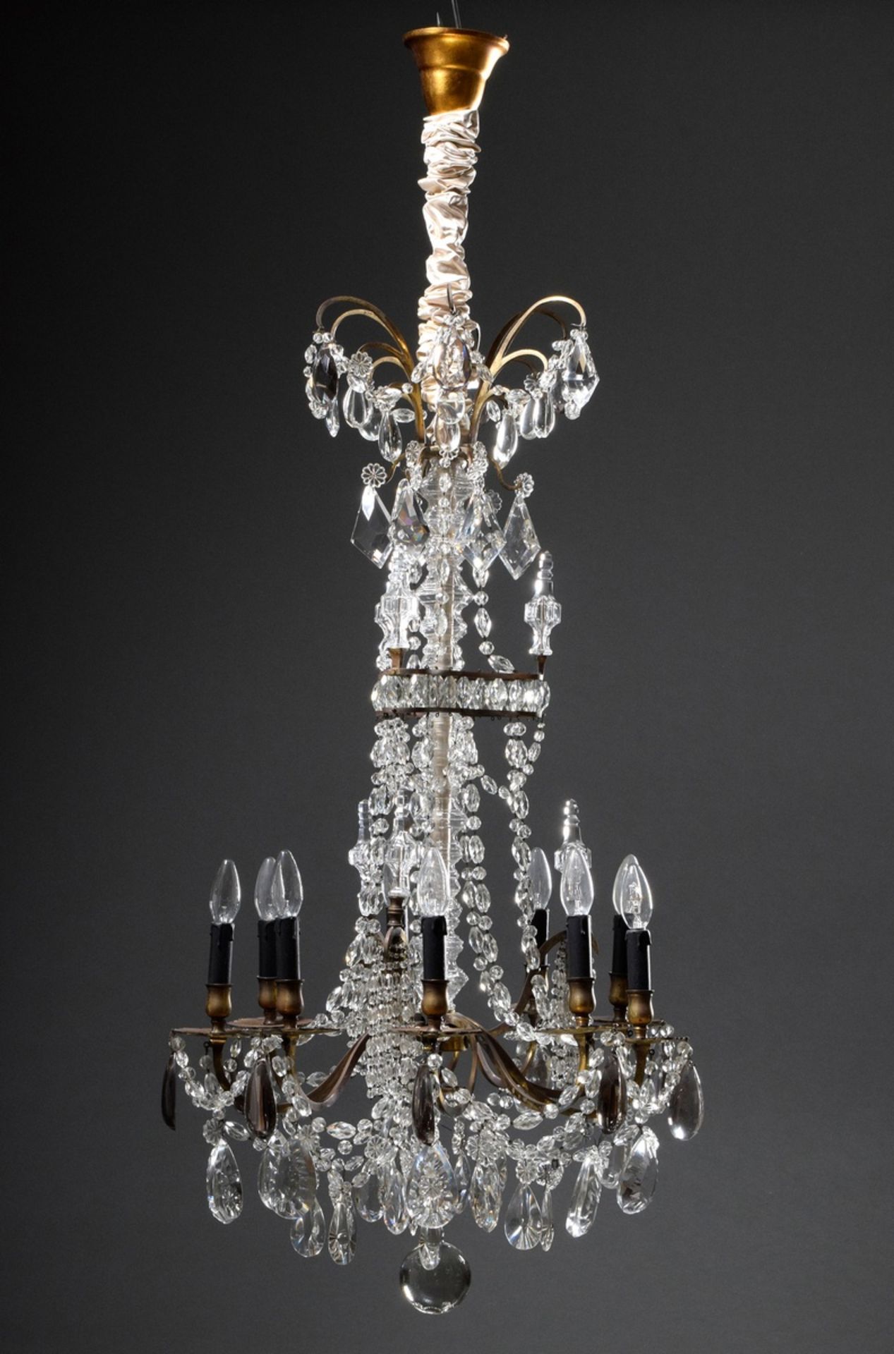 Fire-gilt bronze chandelier with elaborate prismatic hangings and cut balusters on a triangular bas