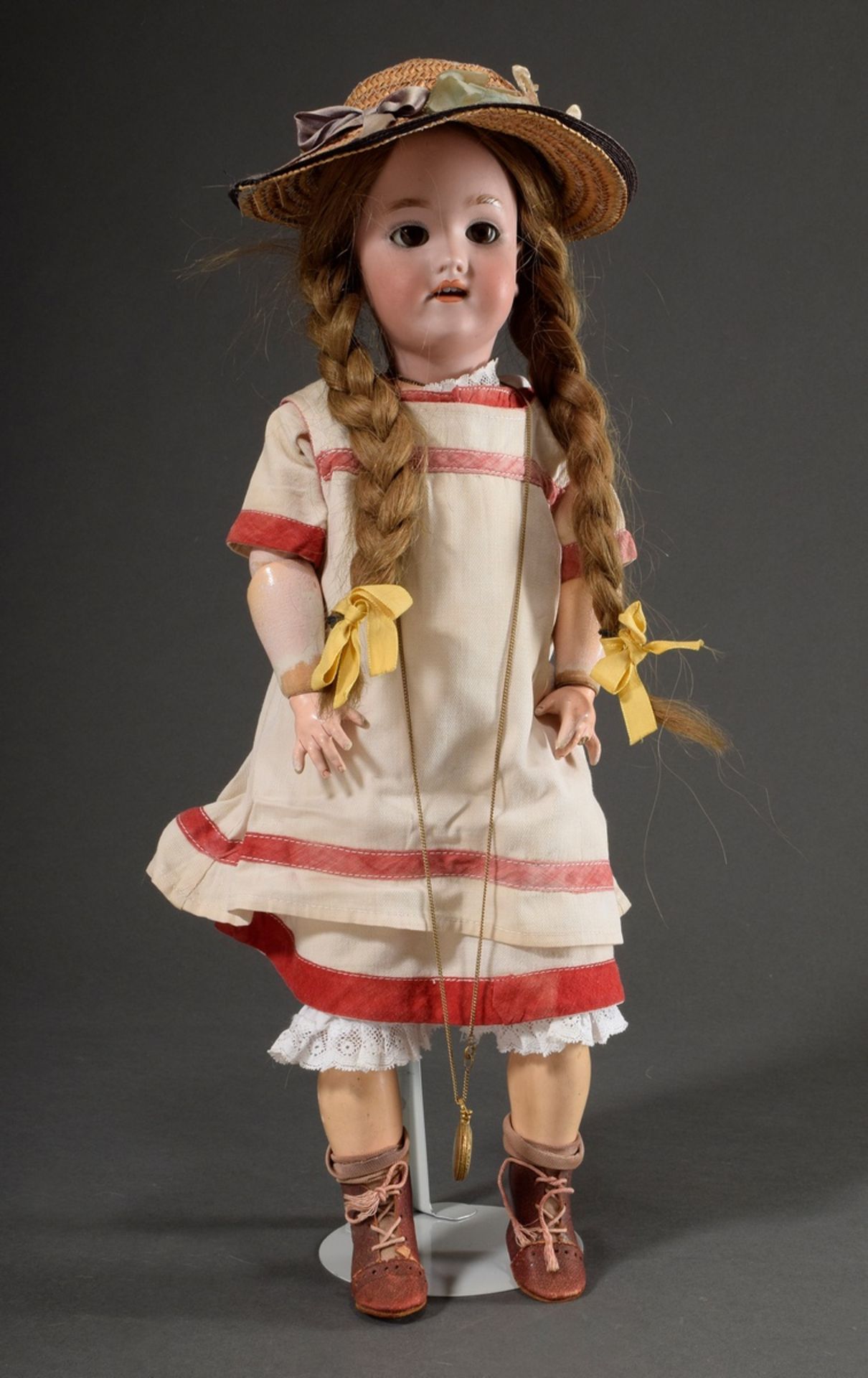 Doll with porcelain crank head and wooden limbed body, dark blond real hair wig, brown glass sleepi