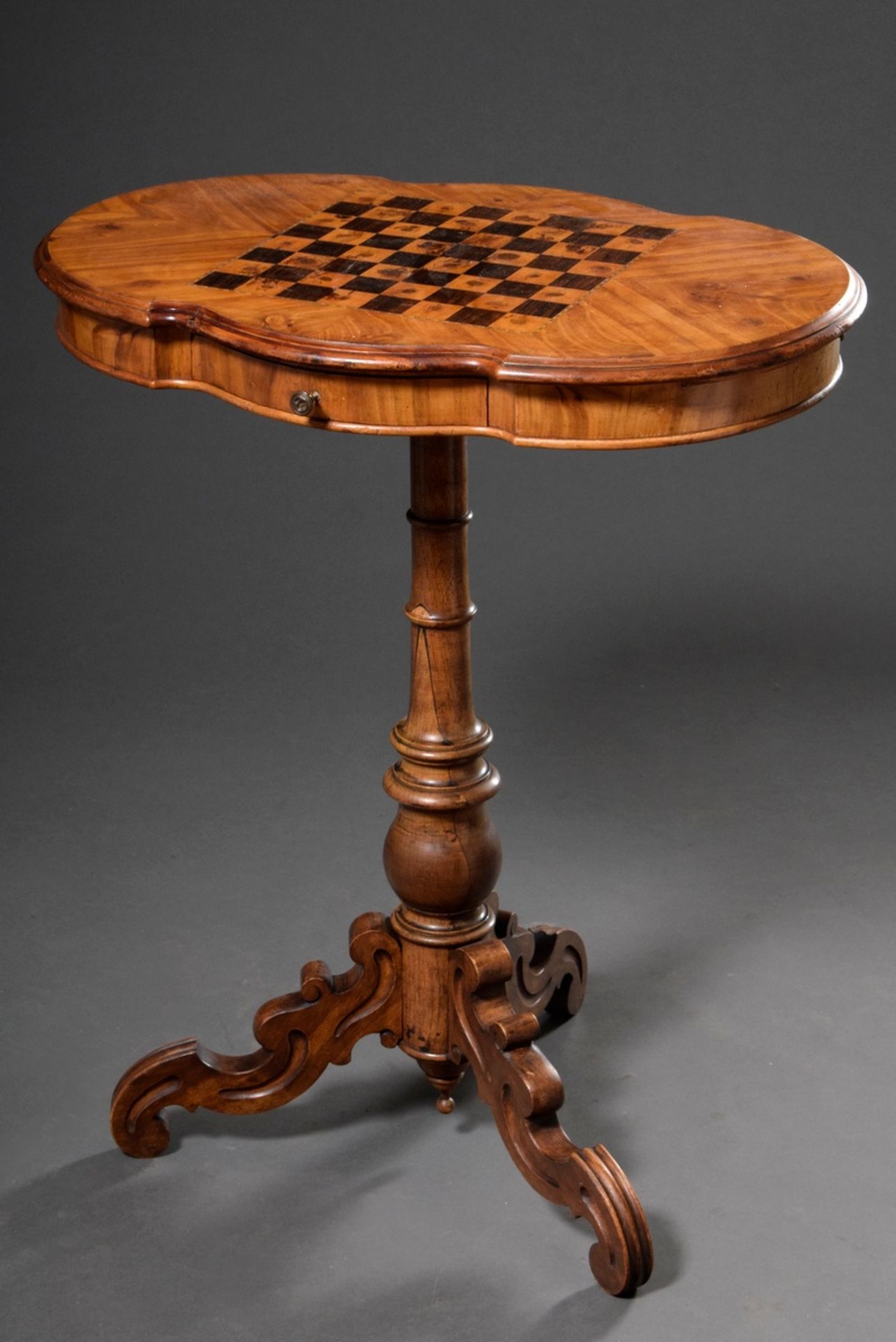 Late Biedermeier chess/mill playing table on central column and triple volute base, walnut veneer, 