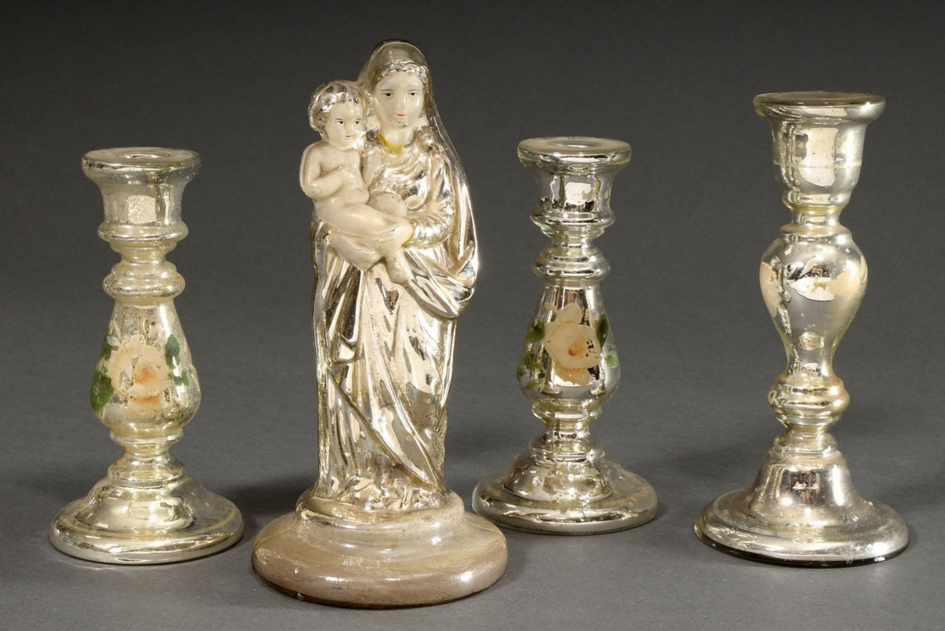 4 Various pieces of mercury silver: 1 Madonna with child (h. 22cm) and 3 candlesticks with "roses" 
