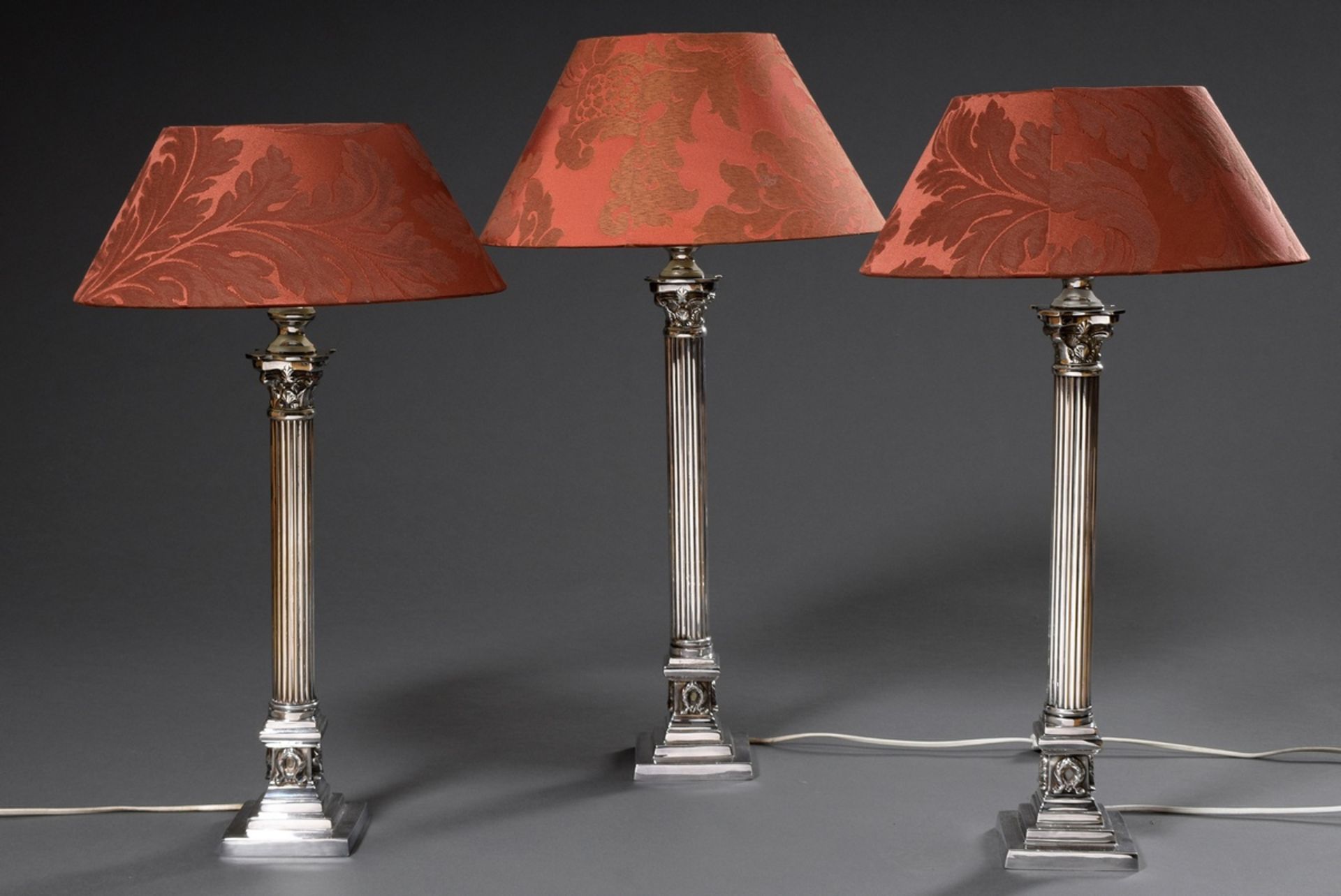 3 Modern silver plated column candlesticks with fluted shaft mounted on angular base as lamps, h. 5