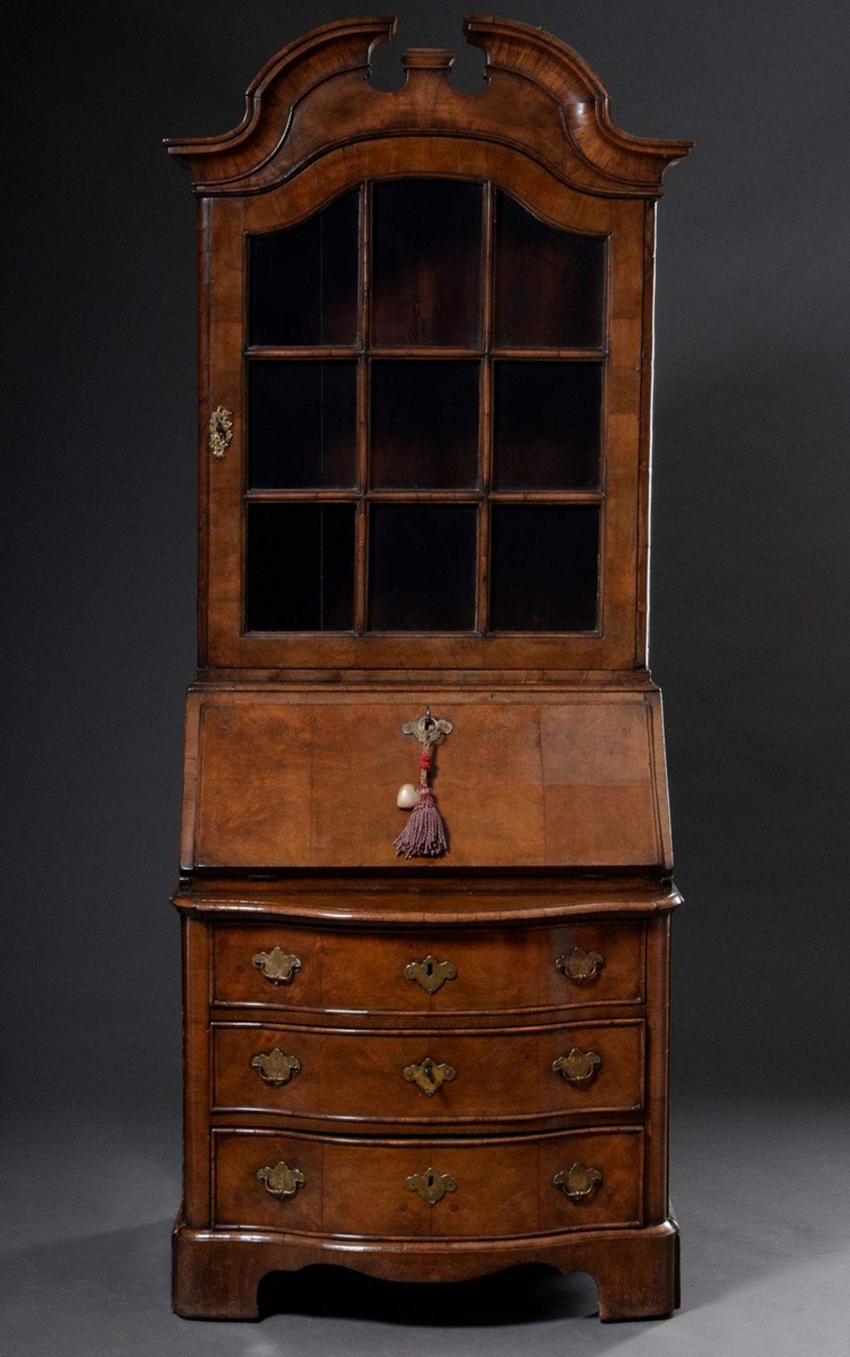 Narrow Baroque secretary à deux corps, with display case top and sprung pediment over sloping writi