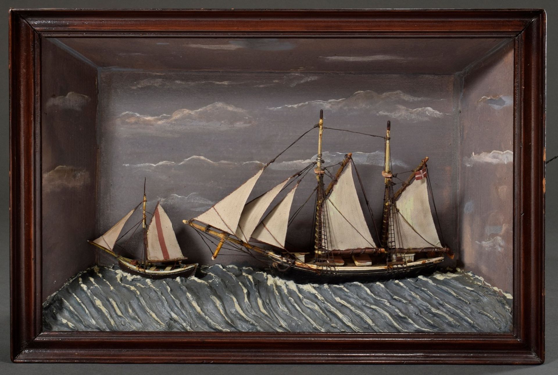 Diorama with full model "Two-master 'Anne'" with dinghy under Danish flag at sea", on the frame ins