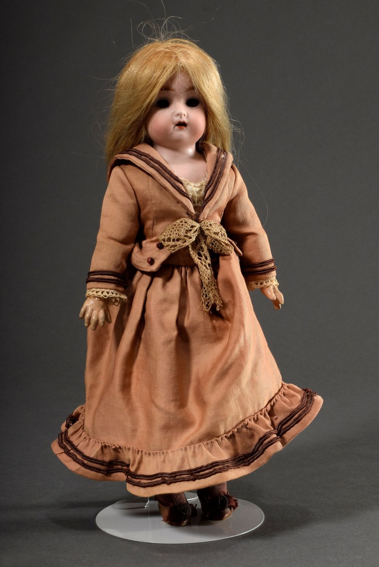 Small doll with porcelain crank head and mass jointed body, ash blond mohair wig, brown glass eyes,