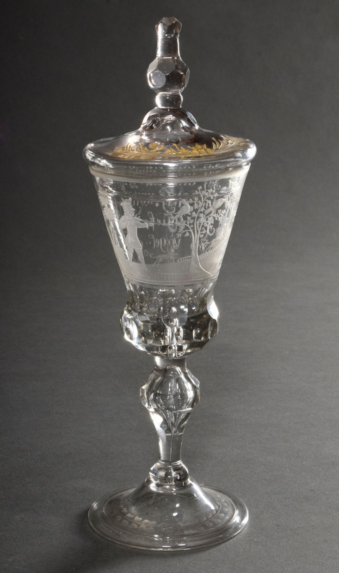 Baroque lidded goblet on a round foot with faceted baluster stem, pierced air bubble and engraved m