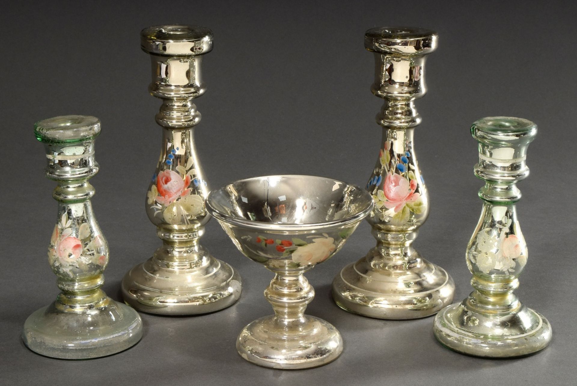 5 Various pieces of mercury silver: 1 goblet and 2 pairs of candlesticks with "flowers" decor, h. 1