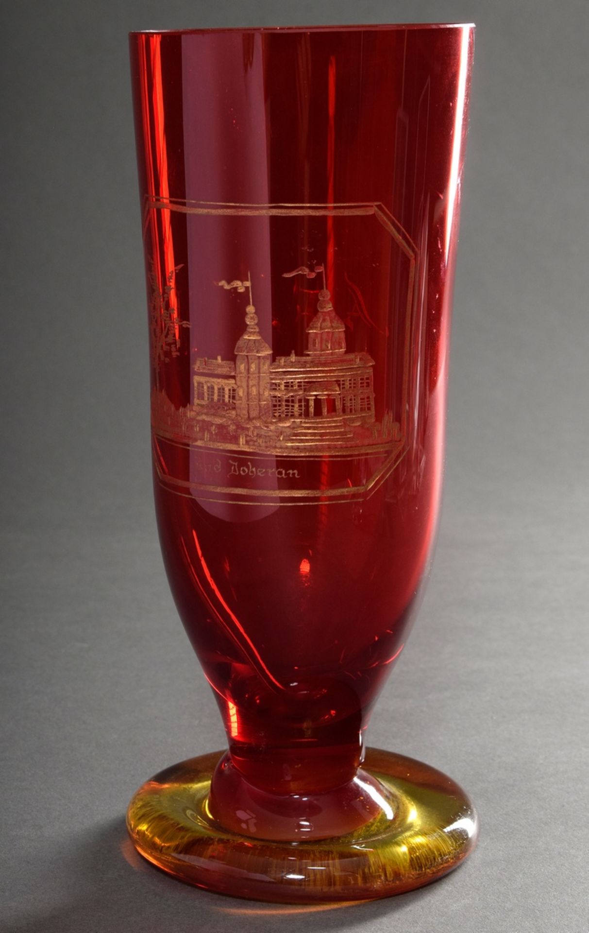 Tall red Biedermeier bath glass with finely cut, gilded view "Bad Doberan" and monogram "A.F" on a 