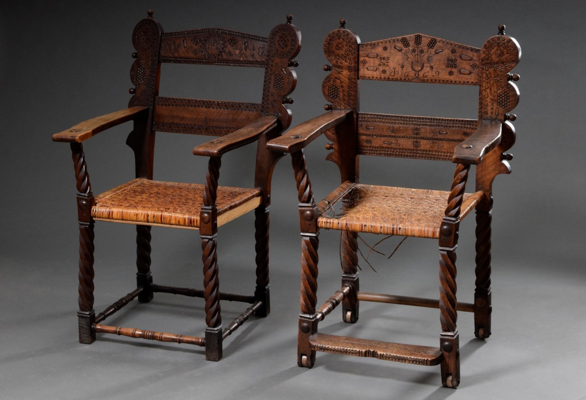 Pair of museum armchairs with finely carved decorations in the backrest, spirally twisted legs and 