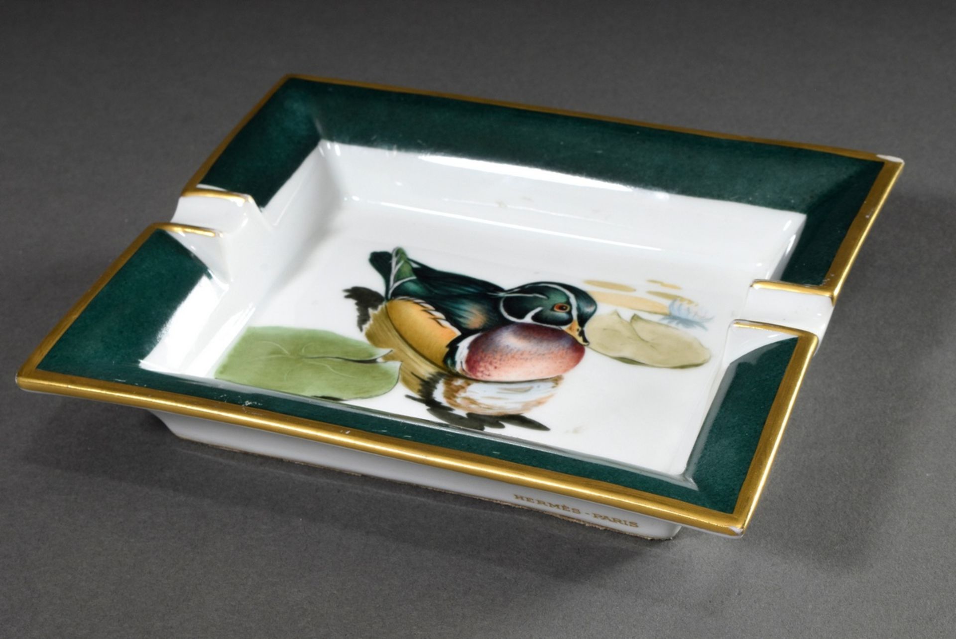 Hermès porcelain ashtray "Brautente", colourfully painted in green/gold, sign. Rybal, 19x18cm, rubb - Image 2 of 5