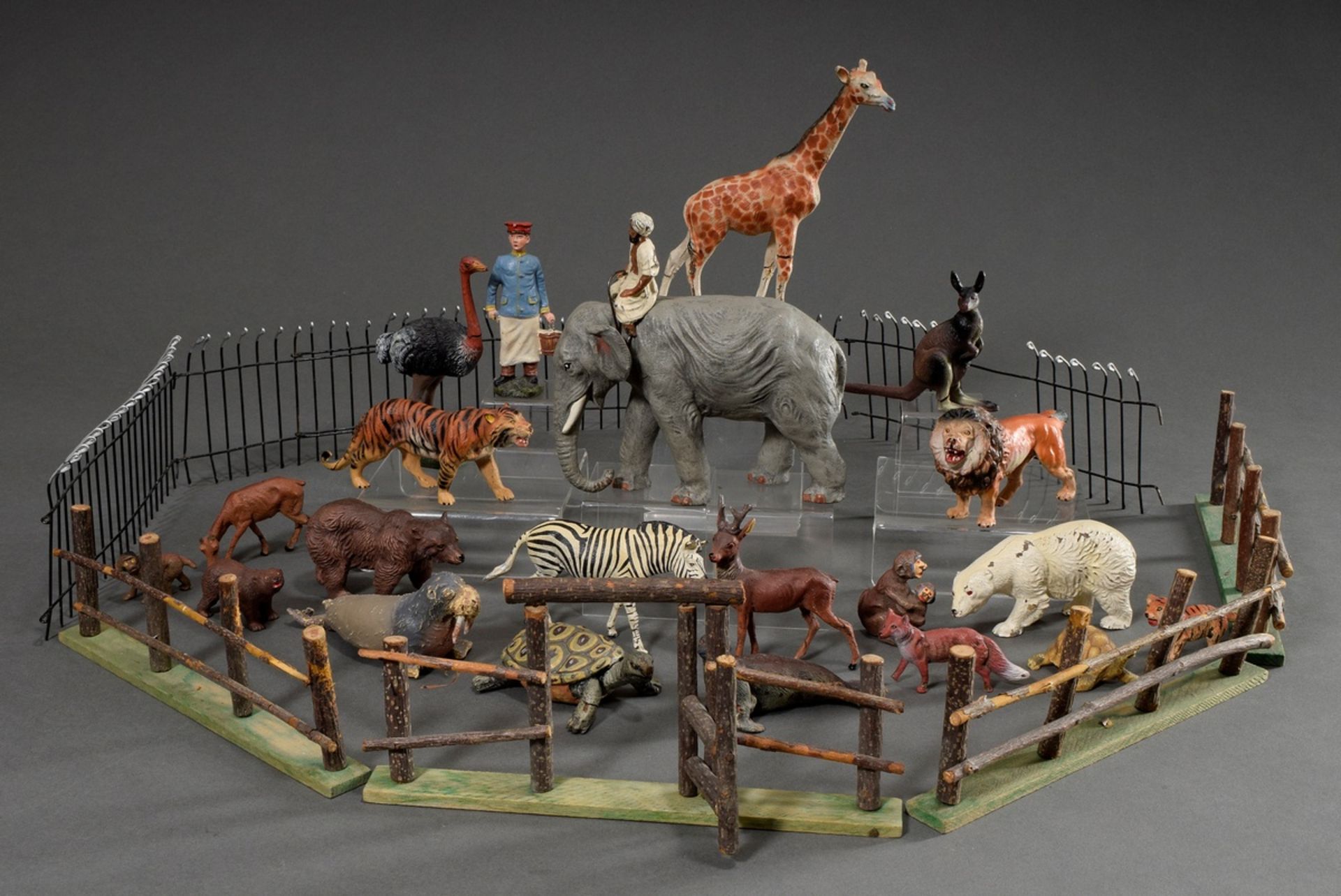 22 Various elastolin and mass figures "zoo animals and keepers", colourfully painted, in addition w