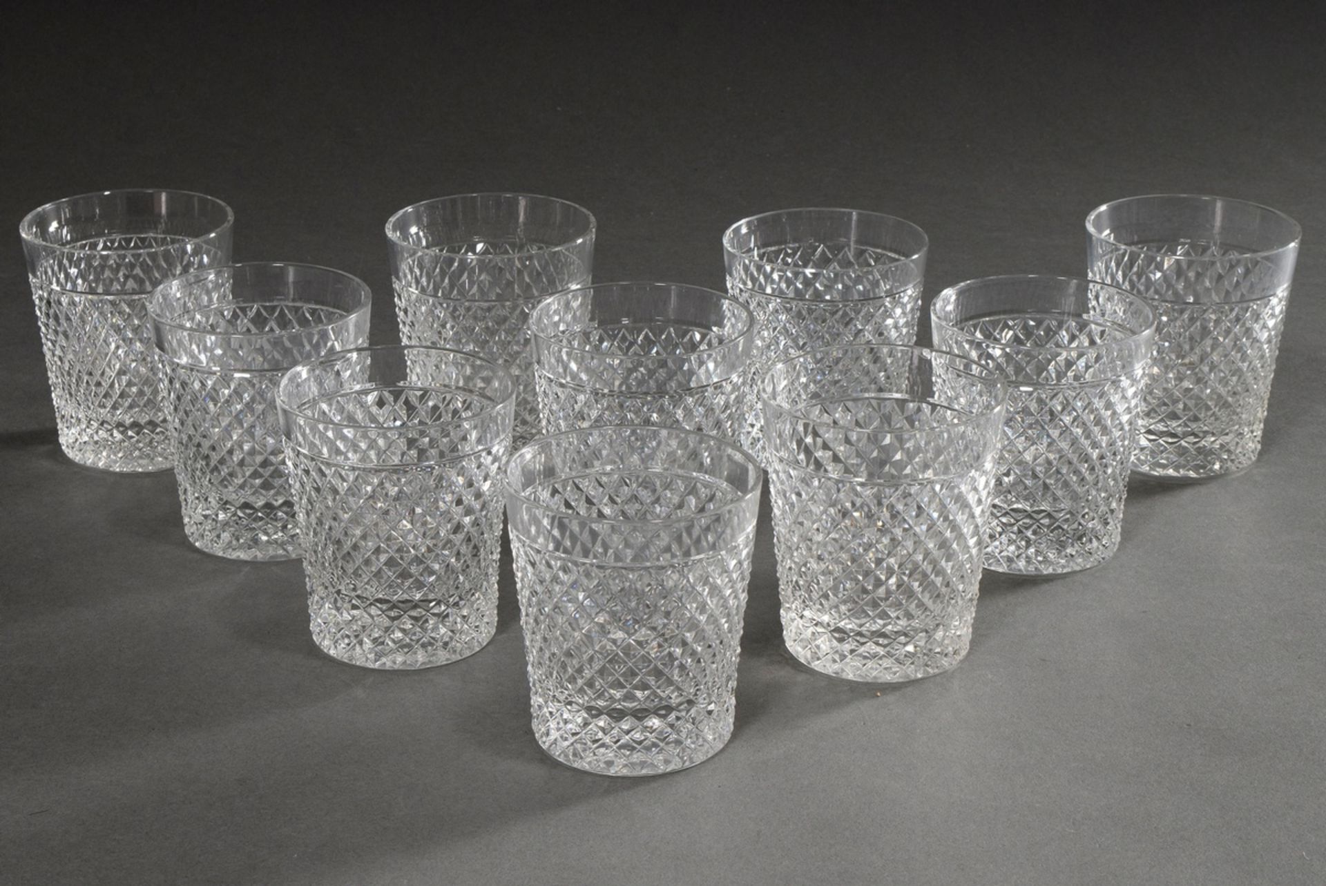 10 beakers with stonel cut, colourless glass, 20th century, slightly varying in height, h. 8,5-9cm,