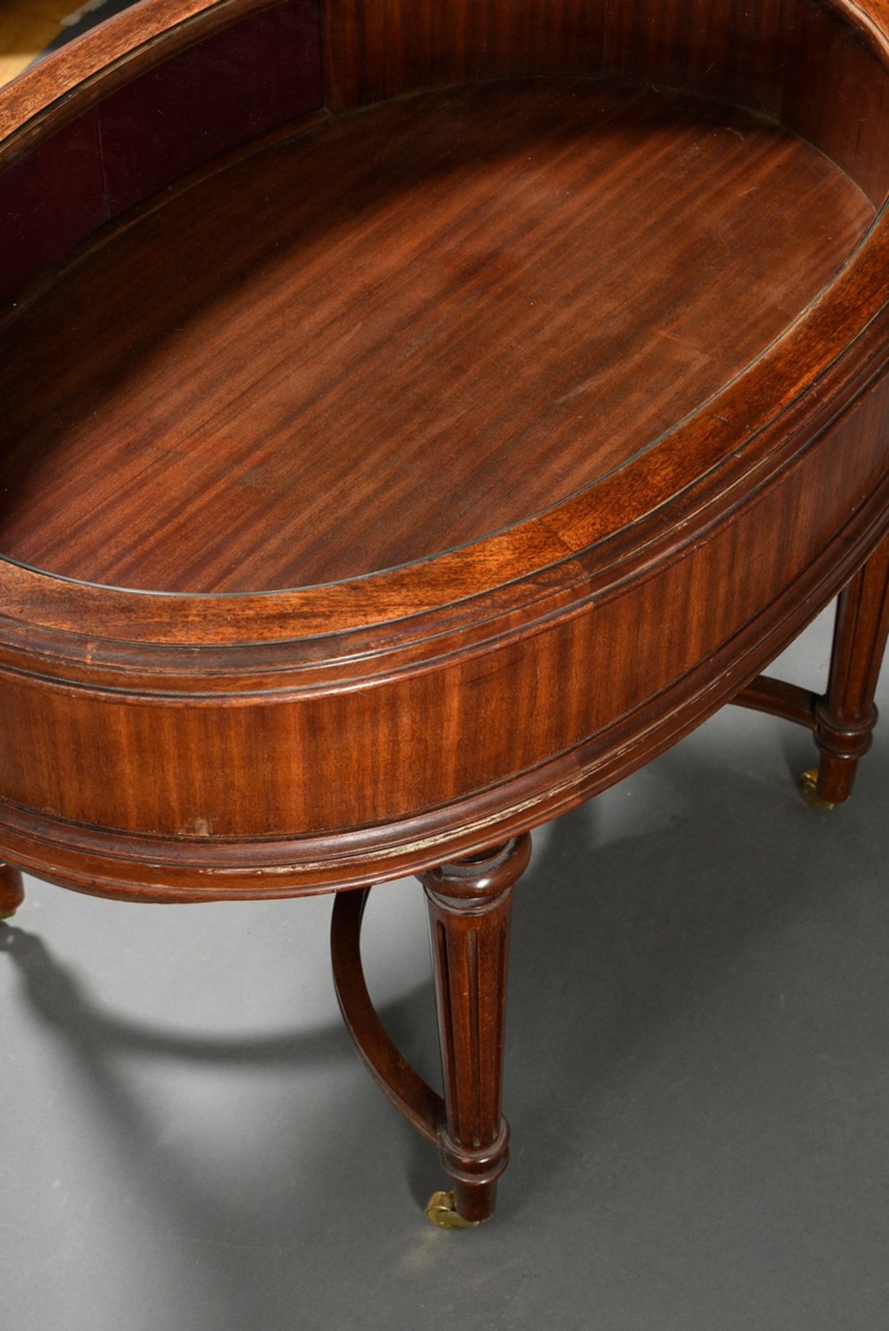 Low oval mahogany display table with glass top and side roll closure, underside signed. "Paul Tibur - Image 5 of 6