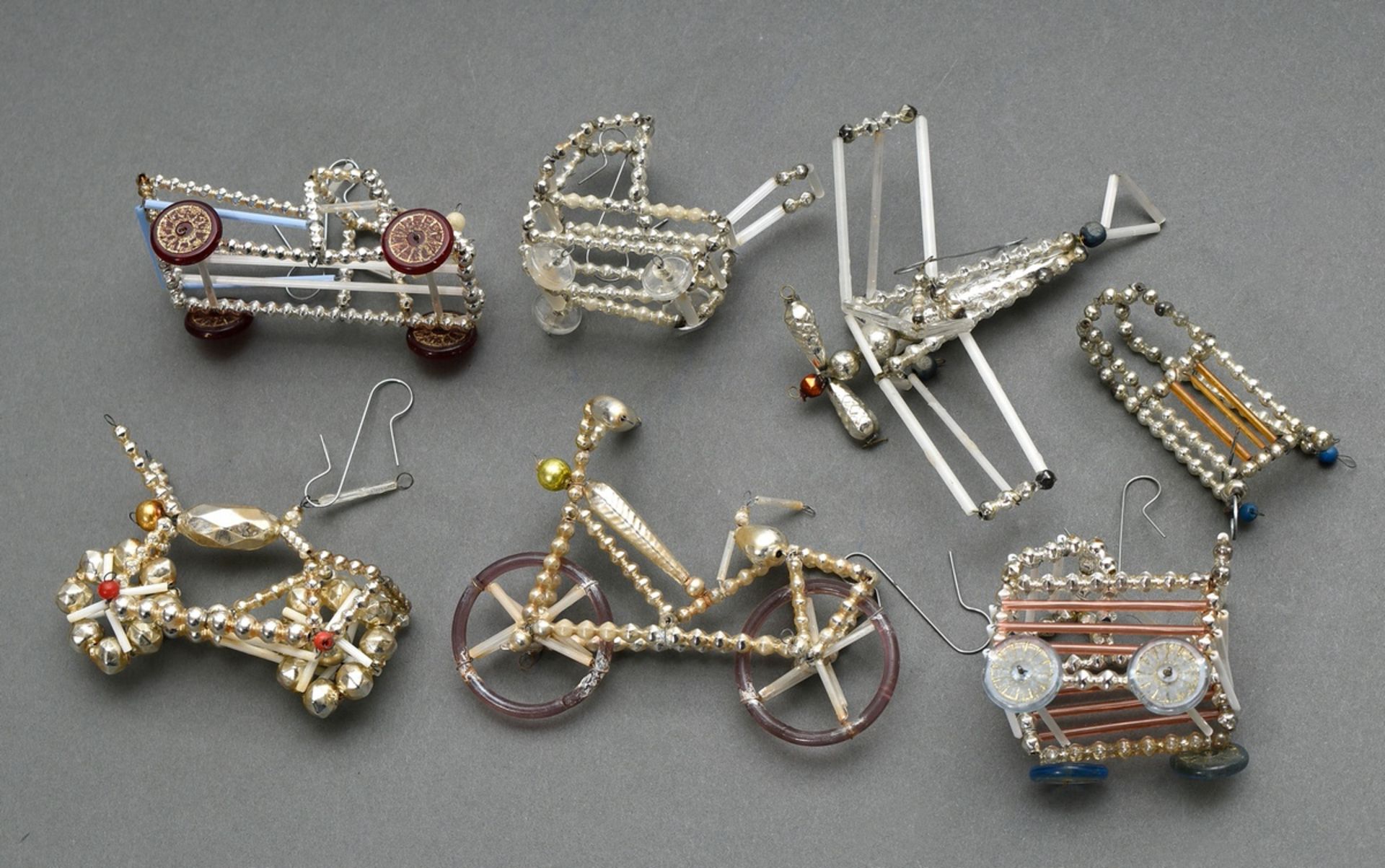 7 Various pieces of Gablonz Christmas decorations "Vehicles": a.o. pram, bicycle, motorbike, aeropl