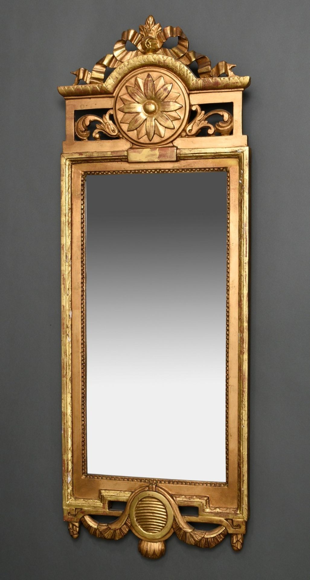 Louis XVI console mirror with rosette cartouche and bow finial as well as leaf hangings, c. 1780, c