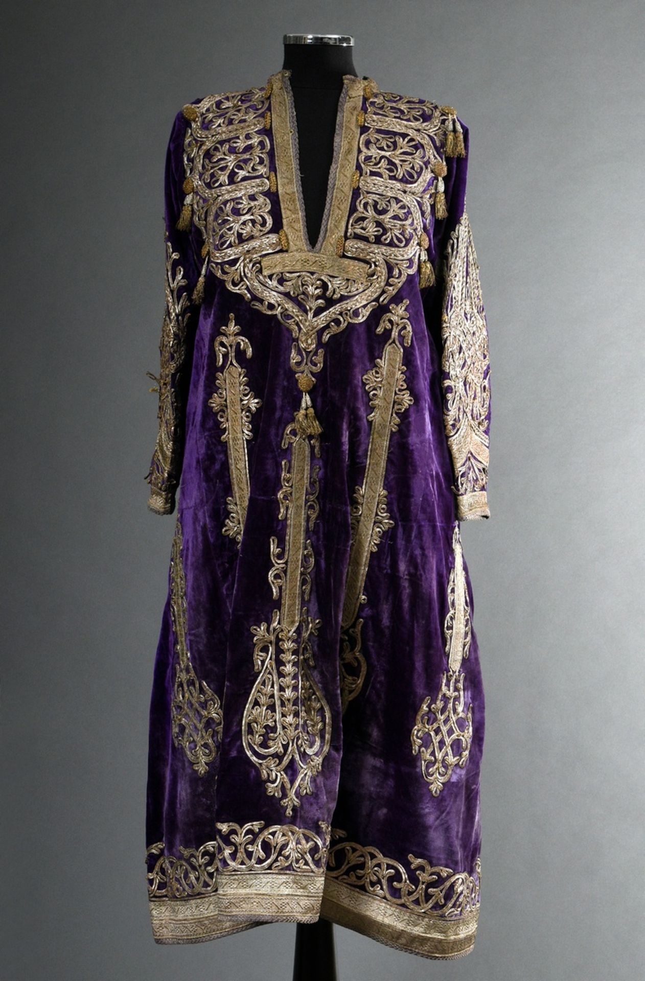 An Afghan wedding garment, purple silk velvet with rich silver thread and trimmings embroidery and 