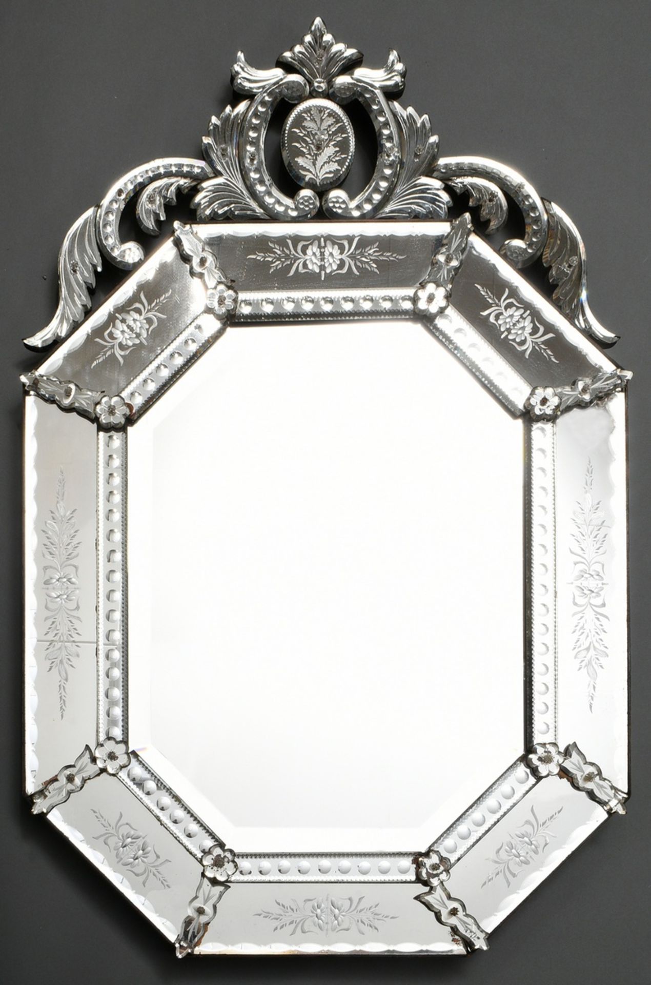 Venetian mirror with vegetal top and cut ornaments, inner mirror glass faceted, outer mirror glass 