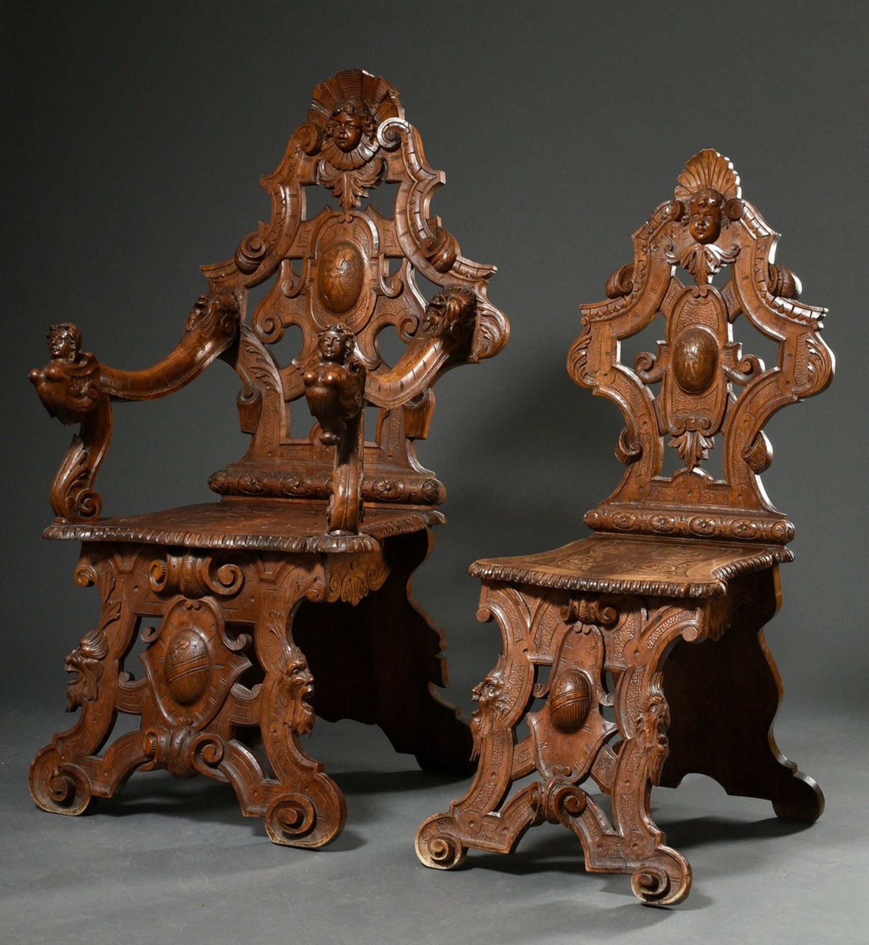 2 pieces Wilhelminian board chair and armchair with opulent carvings "grotesques and masks", h. 46/