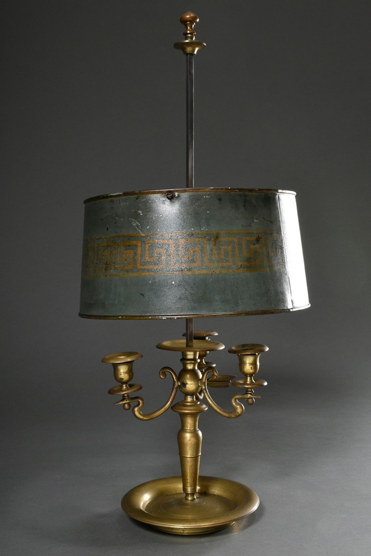 Yellow cast bouillotte in simple form with 3 height-adjustable candelabra arms and the same green p