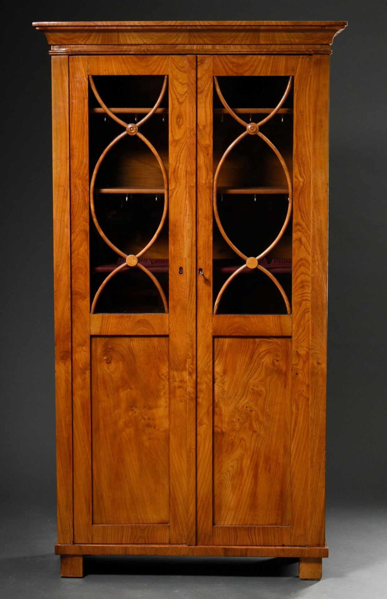 Narrow Biedermeier showcase with half glazed doors and arched struts, ash veneered on softwood, 192
