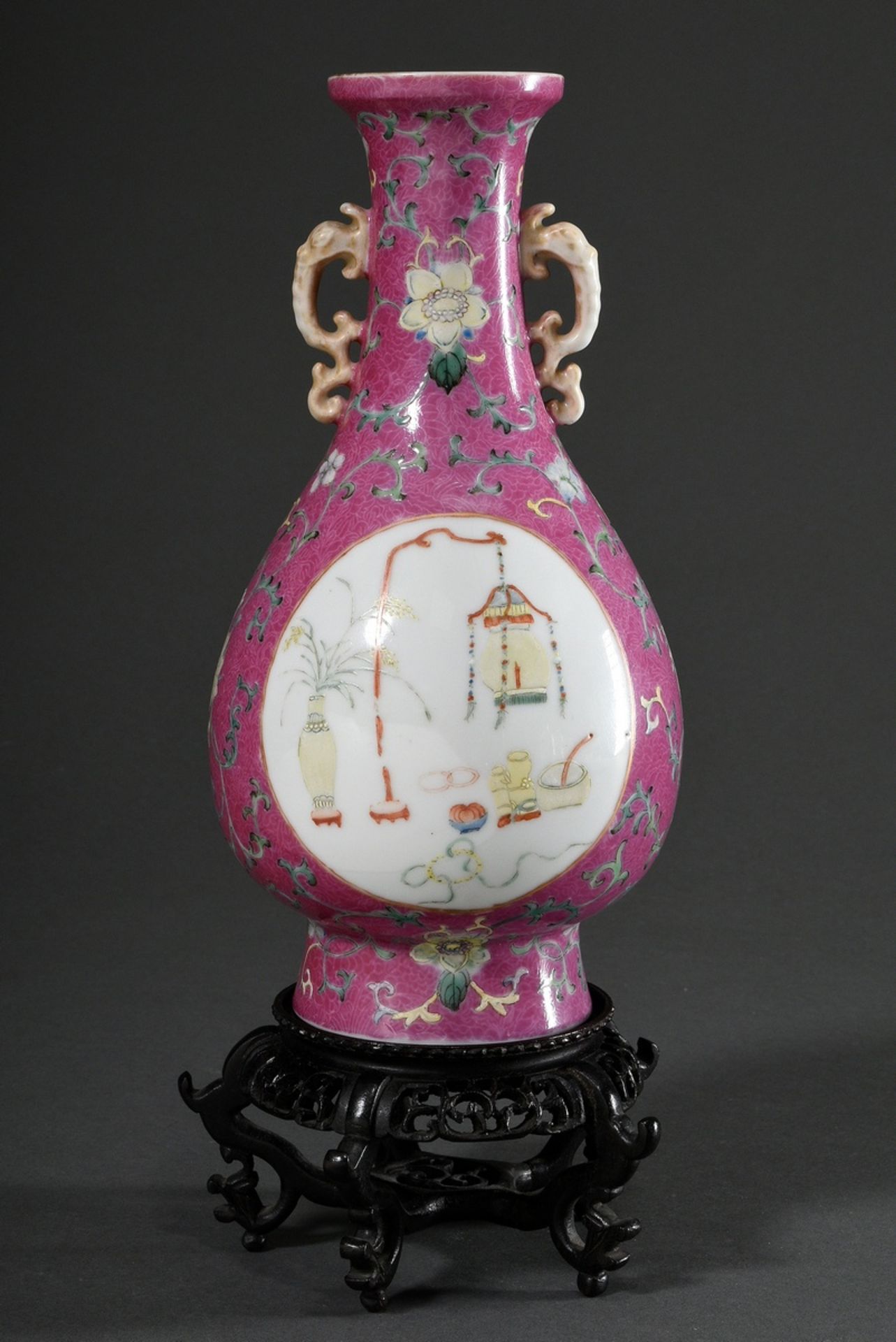 Baluster vase on a high stand ring with stylised elephant head handles and delicate enamel painting