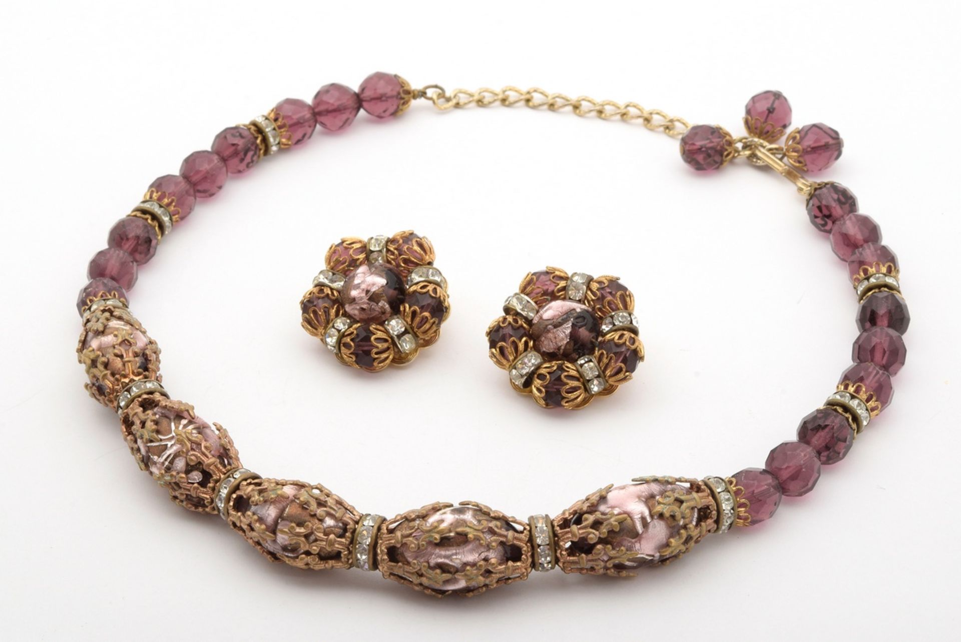 3 pieces of gold-plated vintage costume jewellery with violet glass and rhinestones, signed "Hobé":
