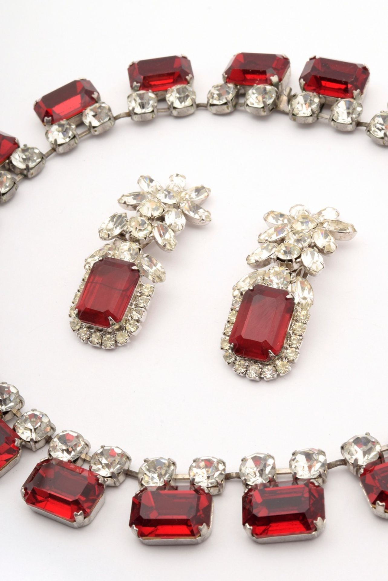 3 pieces of opulent Midcentury costume jewellery made of white metal with red and white rhinestones