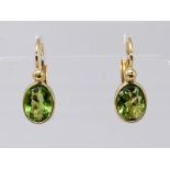 Paar Ohrringe mit Olivin Peridot. 21. Jh. 585/- Gelbgold. Gesamtgewicht ca. 2,4 g. Hochoval