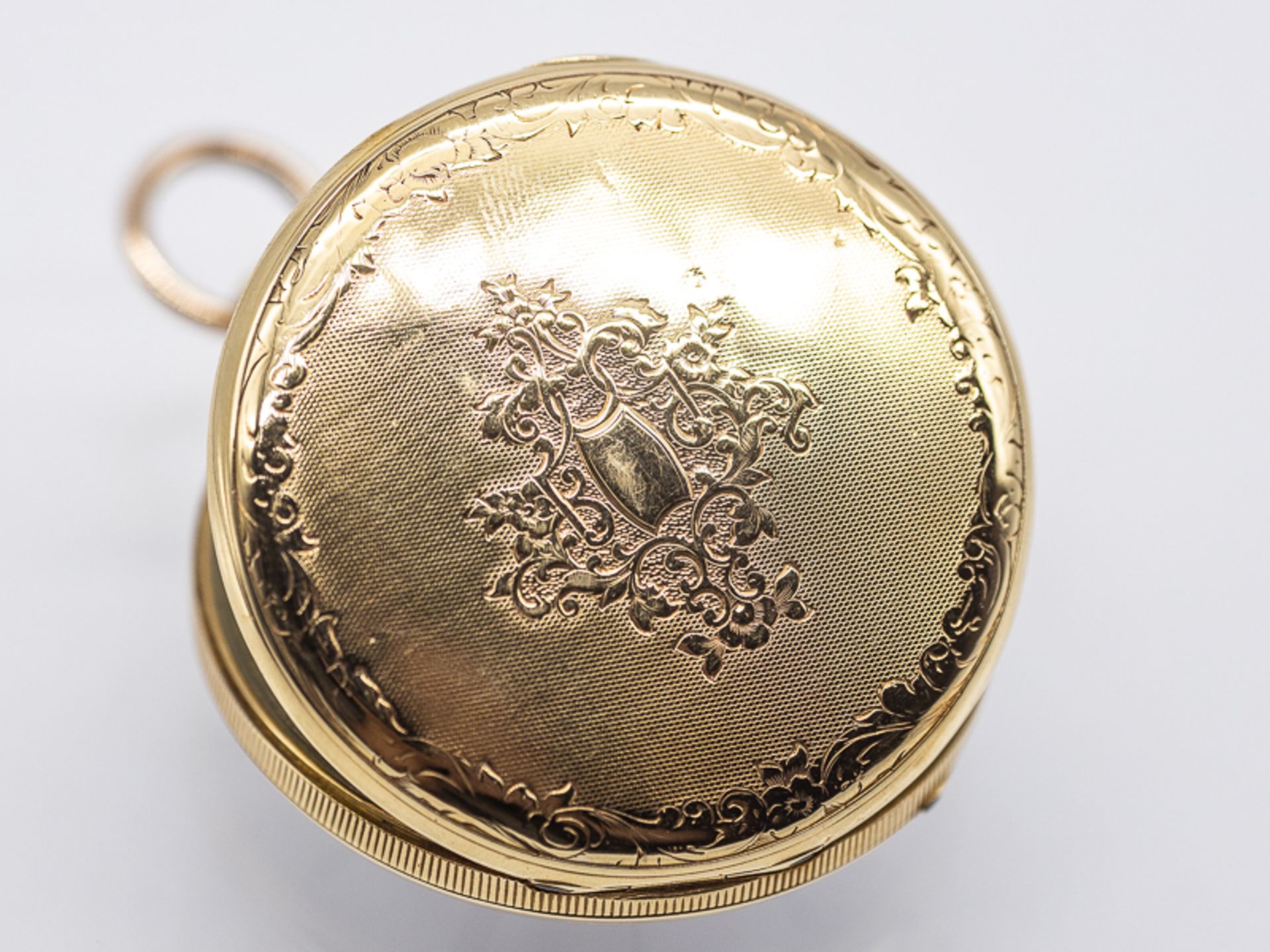 Taschenuhr, sogenannte Schlüsseluhr, 1. Hälfte 19. Jh. Gold und Metall. Gesamtgewicht ca. 49 g.