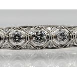 Art Deco-Stabnadel mit 5 Brillanten, zus. ca. 1,21 ct und 16 kleine Diamanten, zus. ca. 0,18 ct, um