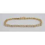 Armband mit 21 kleinen Dia.-Brillanten, 585er Gold, Gew.6,70g