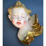 Engel-Kopf, wohl 19. Jh., Holz geschnitzt und farbig gefaßt, sehr schöne plastische Aus-
