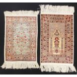 2 Seidenteppiche bzw. Orientteppiche, Türkei, Hereke, mit ornamentalen und floralen Mustern, 66 x 47