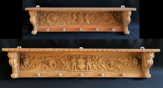 2 Bords als Garderobe, geschnitzt mit Figuren, 19./20. Jh., Holz, Altersspuren, L. 114 und 86 cm