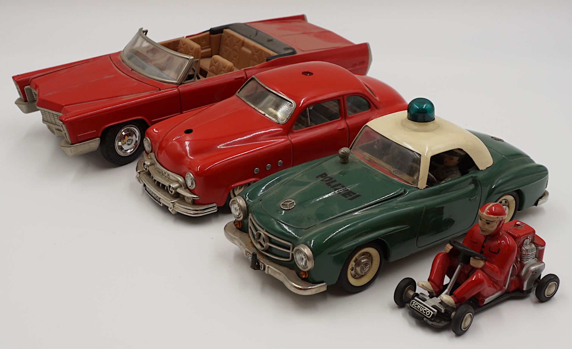 4 SCHUCO-Autos: "Elektro Razzia Car 5509", "Ingenico 5335", " Schuco Cadillac De Ville Convertible 5