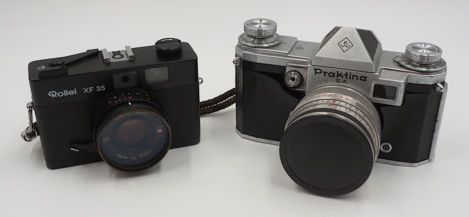 2 Fotoapparate KW "Praktina II A"/ROLLEI "XF 35" mit Objektiv ENNA "Tele-Ennalyt", Zubehör u.a., Gsp