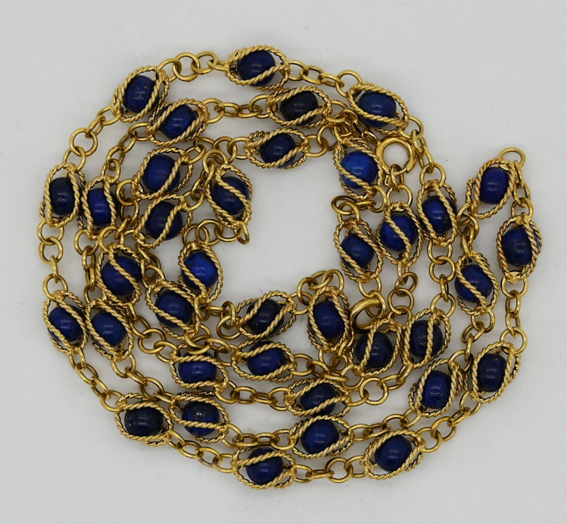 1 Kette sowie 1 Armband GG 14ct. wohl mit Lapislazuli-Kugeln, min. Tsp.