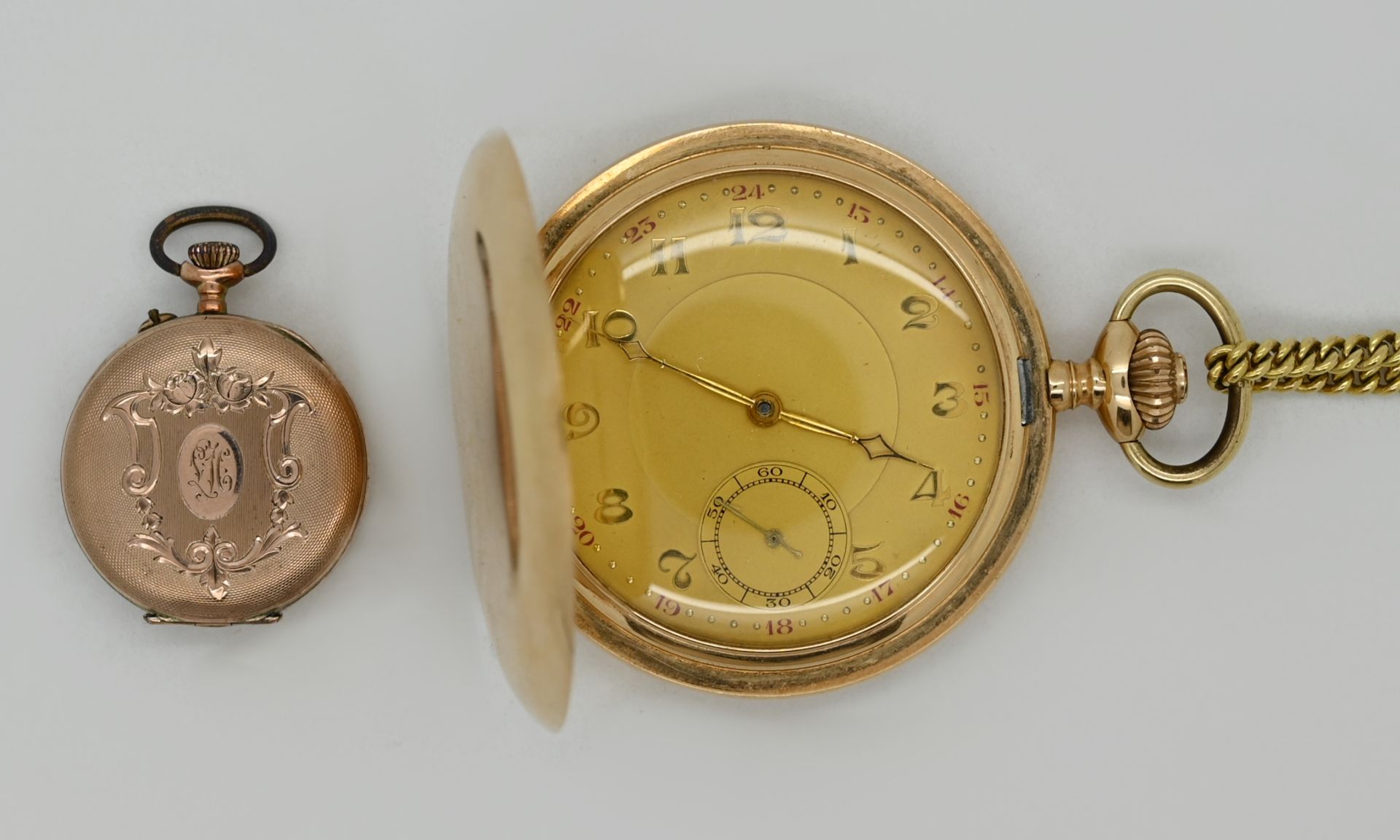 1 Herrentaschenuhr GG 14ct., Kette vergoldet sowie 1 Damentaschenuhr wohl RG um 1900 jew. Asp./ Gsp.