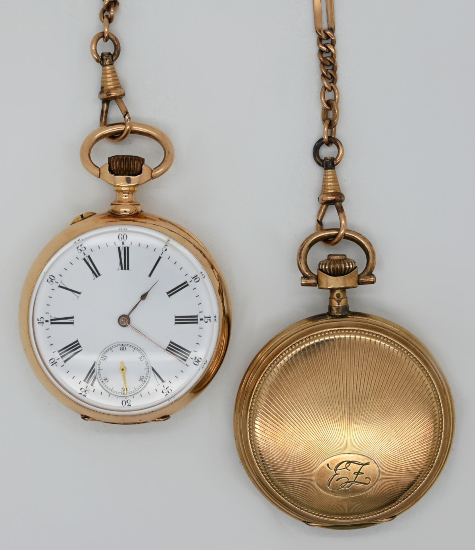 1 Taschenuhr ungest. wohl GG 14ct. Paris um 1900 sowie 1 Taschenuhr mit Uhrkette vergoldet jew. Asp.