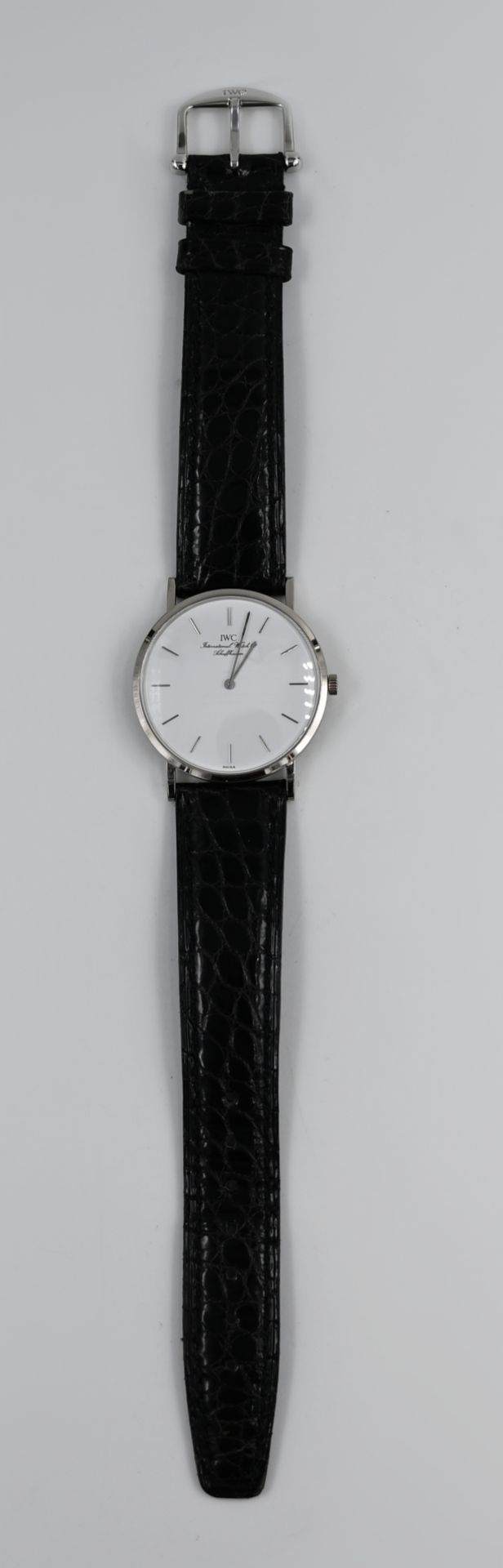 1 Armbanduhr IWC WG 18ct. mit Originallederband schwarz, Reiseetui, Handaufzug, Uhr läuft an, guter