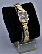 Damen Armbanduhr Ruhla 60er Jahre, Gehäuse m. schwarzem Zifferblatt und arabischen Zahlen, dehnbare