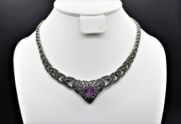 Markasit Collier mit Amethyst ca.0,35ct., neuzeitlich im Stil des Historismus, verschiedene Materia