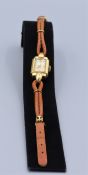 Damen Armbanduhr Marke GUB 1950er Jahre, Gehäuse vergoldet, Lederarmband mit Zierelementen,