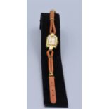 Damen Armbanduhr Marke GUB 1950er Jahre, Gehäuse vergoldet, Lederarmband mit Zierelementen,