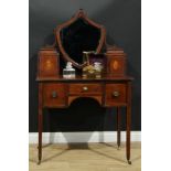 A 19th century mahogany dressing table, the superstructure with a shield-shaped mirror flanked by