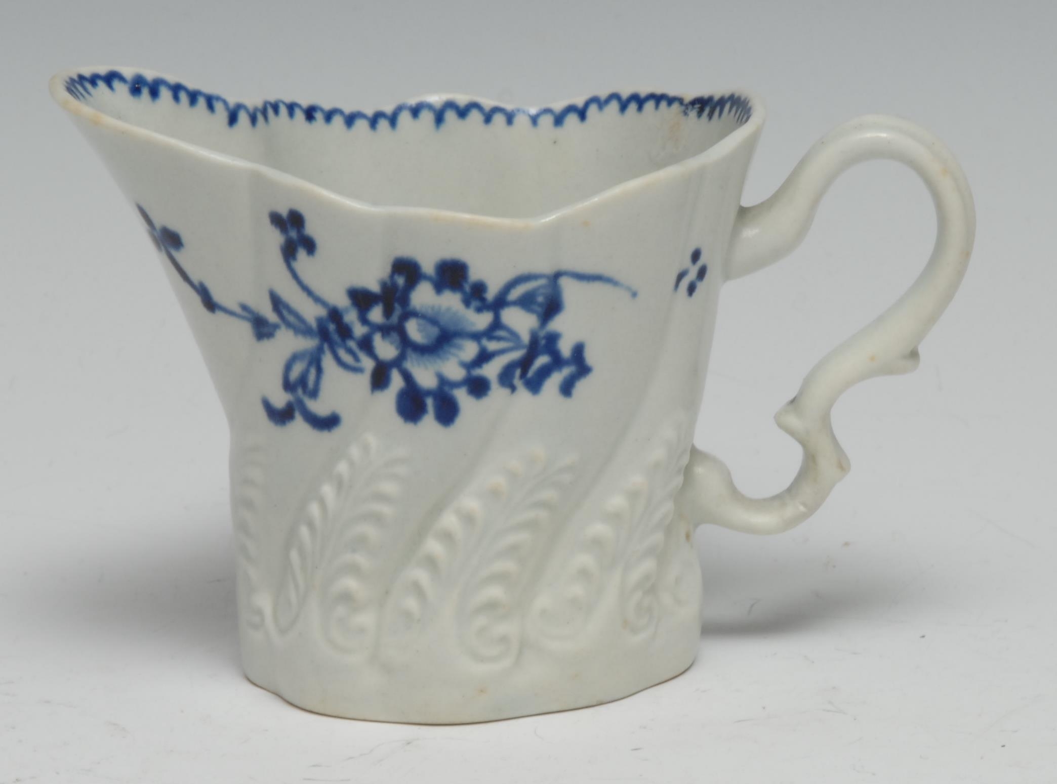 A Liverpool High Chelsea ewer, painted in underglaze blue with flowers, in relief with ferns, 8cm