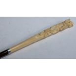 A Japanese novelty ivory and silver-mounted bamboo walking stick, the long tapering handle totem-