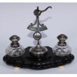 A 19th century Dutch silver and ebonised inkwell, central letter scale flanked by a pair of cut