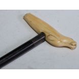 Marine Folk Art - a 19th century sailor's work marine ivory walking stick, the handle naively carved