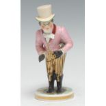 A Samson Hancock Derby figure, of John Liston as Paul Pry, he stands wearing a top hat, pink