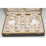 A set of six Royal Crown Derby coffee cups and saucers, painted by Cuthbert Gresley, signed with